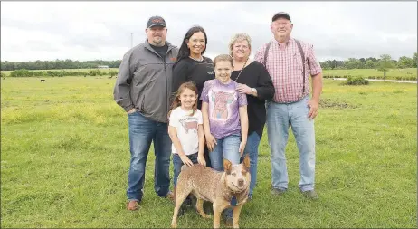  ?? LYNN KUTTER ENTERPRISE-LEADER ?? Washington County's 2022 Farm Family of the Year is the Whorton family: Tim Whorton and his wife, Stephanie, right; their son, Tyler Whorton, and his wife, Matea, and their children, Maebree, 10, and Basilee, 5, and the family dog, Rooster. The Whortons have beef cattle and hay. Their farm, called Wharton Cattle Company, is located off Old Cincinnati Road outside Lincoln.