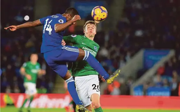  ?? AFP PIC ?? Leicester’s Ricardo Pereira (left) and Brighton’s Solly March battle for the ball at King Power Stadium on Saturday.