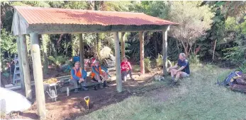  ?? ?? L-R: Katikati Tramping Club volunteers Peter Williams, Brett Wisheart, Laraine Hughes and David Vickers at the partially completed shelter. PHOTO: Supplied.