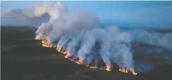  ?? B.C. WILDFIRE SERVICE VIA REUTERS ?? Smoke rises from a wildfire near Fort St. John on Saturday. On Wednesday, the city lifted an evacuation alert that had put the community of about 21,000 residents on edge.