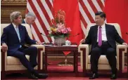  ?? — AFP ?? US secretary of state John Kerry ( left) with China’s President Xi Jinping at the Great Hall of the People at the end of the eighth round of US- China strategic and economic dialogues in Beijing on Monday.