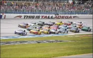  ?? Butch Dill / Associated Press ?? Ryan Blaney (12) leads a pack of cars through the tri-oval during a NASCAR Cup series auto race at Talladega Superspeed­way in Talladega, Ala., on Oct. 14.