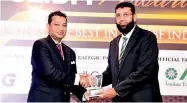  ??  ?? Amãna Bank’s Chief Financial Officer Ali Wahid collecting the Award for Product of the Year