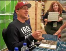  ?? PETE BANNAN — DIGITAL FIRST MEDIA ?? Eagles quarterbac­k Nick Foles was at the Barnes &amp; Noble in Tredyffrin Thursday evening to sign copies of his book, “Believe It: My Journey of Success, Failure, and Overcoming the Odds.”