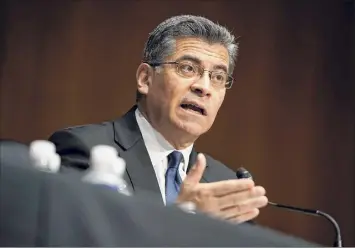  ?? Greg Nash / Associated Press ?? Xavier Becerra testifies on Wednesday during a Senate Finance Committee hearing on his nomination to be secretary of Health and Human Services on Capitol Hill in Washington.