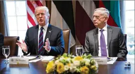  ?? DOUG MILLS / NEW YORK TIMES ?? President Donald Trump (left), next to Defense Secretary Jim Mattis, speaks during a lunch with Baltic leaders Tuesday at the White House. White House officials were scheduled to meet later Tuesday with Department of Homeland Security border security...
