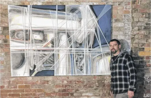  ?? SCOTT WHIPPLE VIA AP ?? Jared Whipple in 2017 stands next to a painting by Francis Hines that was found in a dumpster in Watertown, Connecticu­t.