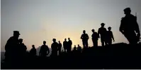  ?? AP ?? Pakistan soldiers gather at a forward area post on the Line of Control, that divides Kashmir between Pakistan and India, in Tatta Pani, some 200km from Islamabad, Pakistan.