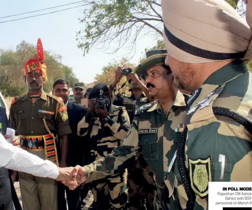  ??  ?? IN POLL MODE Rajasthan CM Ashok Gehlot with BSF personnel on March 6