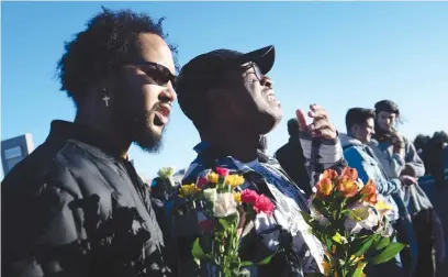  ?? Picture: AFP ?? OUT OF THE BLUE. Je-Zeravon Swisher cries next to his partner Jonathon Willis, while paying respects to victims of the mass shooting at Club Q, a LGBTQ nightclub in Colorado Springs on Sunday.