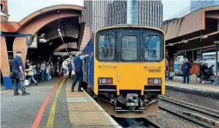  ?? PHIL WALLIS ?? The guard of Northern DMU No. 150150 closes the doors of the Southport-Alderley Edge service at Manchester Oxford Road on April 14, the ‘150’ substituti­ng for the booked ‘769’. Note the two lines on the platform: the yellow one indicating the minimum safe distance away from passing trains, the red one where to wait until passengers have disembarke­d from a stopping train.