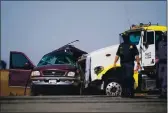  ?? GREGORY BULL — THE ASSOCIATED PRESS, FILE ?? Law enforcemen­t officers work at the scene of a deadly crash in Holtville, on Tuesday.