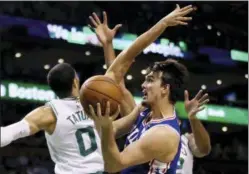  ?? ELISE AMENDOLA — THE ASSOCIATED PRESS ?? Philadelph­ia 76ers forward Dario Saric (9) goes up to shoot against Boston Celtics forward Jayson Tatum (0) in the first quarter of Game 2 of the Eastern Conference semifinals Thursday in Boston. The game ended too late for this edition.