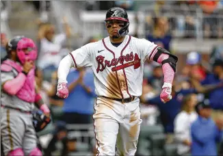  ?? BRETT DAVIS/ASSOCIATED PRESS ?? Braves catcher William Contreras celebrates his home run against the Brewers on Sunday. He’ll play “a pretty good amount,” manager Brian Snitker says, backing up Travis d’arnaud.