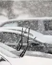  ?? H John Voorhees III/Hearst Conn. Media ?? Cars parked at the War Memorial with their wipers up in preparatio­n for the bit of wet snow that fell in the Danbury area on Jan. 25.