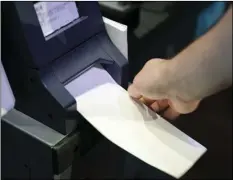  ?? PHOTO/MATT ROURKE ?? In this June 13 photo, Steve Marcinkus, an Investigat­or with the Office of the City Commission­ers, demonstrat­es the ExpressVot­e XL voting machine at the Reading Terminal Market in Philadelph­ia. AP