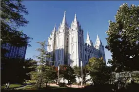  ?? Rick Bowmer / Associated Press ?? The Salt Lake Temple stands at Temple Square in Salt Lake City on Oct. 5, 2019. Merrill Nelson, a Utah lawmaker and prominent attorney for the Church of Jesus Christ of Latter-day Saints, advised a church bishop not to report a confession of child sex abuse to authoritie­s, a decision that allowed the abuse to continue for years, according to records filed in a 2021 lawsuit by three of Paul Adams’ children.