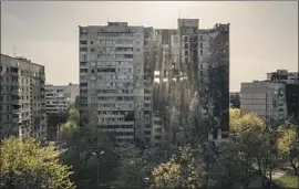  ?? Felipe Dana Associated Press ?? A BUILDING in Kharkiv, Ukraine, is badly damaged by Russian bombardmen­ts.