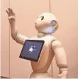  ?? ROBYN BECK, AFP/GETTY IMAGES ?? Pepper, an emotive robot from Softbank with a $2,000 price tag, is on sale in Japan.