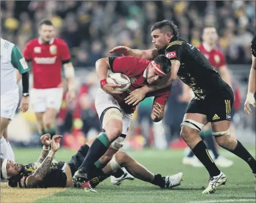  ?? PICTURE: DAVID DAVIES/PA ?? TOUGH NIGHT: British and Irish Lions’ CJ Stander is tackled during the tour match at the Westpac Stadium, Wellington.