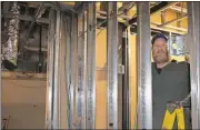  ?? Doug Walker / Rome News-Tribune ?? Michael O’Connor works on the wiring in the shower area of the Redmond Regional Medical Center basement that graduate medical education residents will use when the new program in Internal Medicine begins this summer.