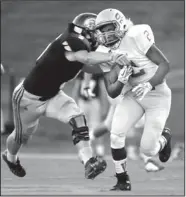  ??  ?? 2oltewah’s Anthony 7urner is brouJht down by Soddy-Daisy’s Austin Goins on Friday niJht.