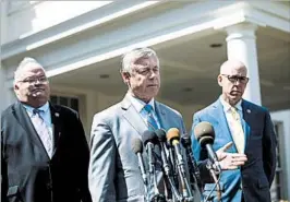  ?? JIM LO SCALZO/EPA ?? Reps. Fred Upton, center, and Billy Long, left, reverse their positions Wednesday after meeting with President Donald Trump at the White House. The House vote is Thursday.