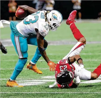  ?? CURTIS COMPTON / CCOMPTON@AJC.COM ?? The Falcons are familiar with Jay Ajayi (left), dealt to the Eagles at the trade deadline. While with the Dolphins, Ajayi rushed 26 times for 130 yards in the 20-17 win over the Falcons on Oct. 15.