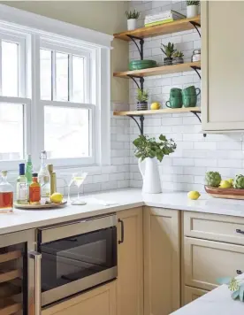  ??  ?? |LEFT| NOOKS AND CRANNIES. These open shelves were an easy and aesthetic solution to the problem of a small space between the wall and the window framing. These narrow open shelves fill the space perfectly and add visual interest.