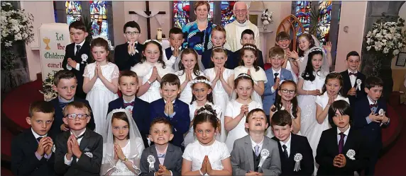  ??  ?? Children from Firies NS, who received their First Holy Communion at St.Gertrude’s Church on Saturday by Rev. Fr. John Aherne PP who is pictured with their teacher Helen Barry. Photo: John Cleary.