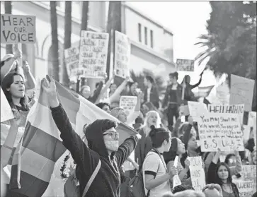  ?? Stuart Palley For The Times ?? DEMONSTRAT­ORS rally at Los Angeles City Hall during the first Women’s March, held on Jan. 21, 2017, one day after President Trump’s inaugurati­on. The march drew hundreds of thousands of participan­ts in L.A.