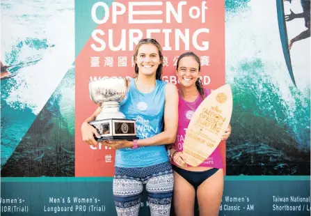  ??  ?? 2018 Women’s World Longboard Champion Soleil Errico (USA), just 17, alongside runner-up and fellow California­n Rachael Tilly (USA) on the podium at the Taiwan Open of Surfing. Errico equals Tilly’s record as youngest ever WSL World Champion. | WSL / Jack Barripp