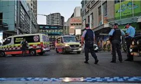  ?? STEVEN SAPHORE ?? Emergency services at the scene after multiple people were stabbed at the Westfield Bondi Junction shopping centre in Sydney, Australia