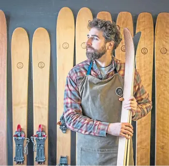  ??  ?? Jamie beside a range of his skis in his workshop in Birnam.