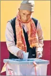  ?? AFP ?? ▪ A man casts his vote at a polling station in Sindhupalc­howk district.