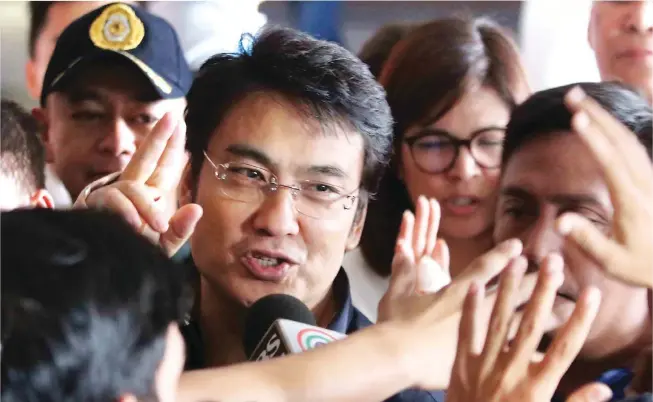  ??  ?? FREEDOM FOR BONG – Former senator Bong Revilla rejoices moments after the court read the decision acquitting him of plunder Friday. (Mark Balmores)