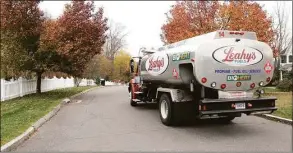  ?? H John Voorhees III / Hearst Connecticu­t Media file photo ?? Leahy's Fuels oil delivery driver Eric Svege makes a home heating oil delivery to a Mariana Farms Drive home in Danbury in November 2014.