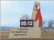  ??  ?? The 25-foot-tall sign sports the school’s logo of an Indian Warrior head. Two red feathers, measuring 13½ feet from top to bottom, add to the dramatic effect. (Catoosa News photo/Tamara Wolk)