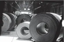  ?? Associated Press file photo ?? Rolls of finished steel are seen at the U.S. Steel Granite City Works facility last year in Granite City, Ill.