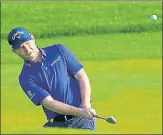  ?? AP ?? South Africa’s Branden Grace chips up to the first green during the second round of the PGA Championsh­ip on Friday.