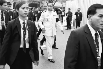  ??  ?? Prayuth arrives at a weekly cabinet meeting at Government House in Bangkok, Thailand. — Reuters photo