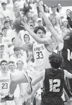  ?? DYLAN SLAGLE/BALTIMORE SUN MEDIA GROUP ?? Century senior Carter Truby passes while under pressure from Liberty's Connor Stewart (12) and Peyton Scheufele during the second half of the Knights' 66-64 win.