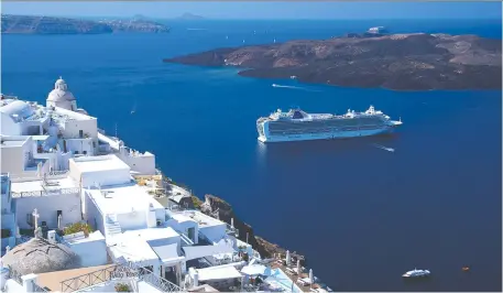  ?? CAMERON HEWITT ?? A cruise ship offers memorably fantastic views of the classic whitewashe­d villages of the Greek island of Santorini.