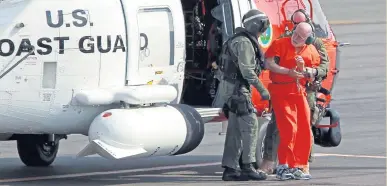  ?? STUART CAHILL / BOSTON HERALD FILE ?? CYCLE OF VIOLENCE: James ‘Whitey’ Bulger is escorted from a Coast Guard helicopter to an awaiting sheriff’s vehicle in 2011.