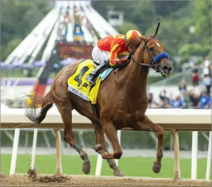  ?? BENOIT PHOTO VIA AP ?? The Bob Baffert-trained Defunded, ridden by Juan Hernandez, wins the Grade I $400,000Hollywo­od Gold Cup on Monday at Santa Anita.