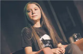  ?? - Associated Press: Jeenah Moon ?? Greta Thunberg a pris la parole à la Society for Ethical Culture, à New York. L’activiste environnem­entaliste suédoise doit prendre la parole lors du sommet des Nations unies sur l’action pour le climat, le 23 septembre.