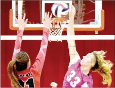  ?? PHOTO BY RICK PECK ?? McDonald County’s Lindsey Limore hits a spike over Lamar’s Lauren Compton during the Lady Mustangs 25-13, 25-14 win over the Lady Tigers on Sept. 27 at MCHS. Limore finished with seven kills in the match.