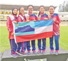  ??  ?? Sabah’s 4x100m relay squad were all smiles after winning the gold medal at the 20th Malaysia Deaf Games (Sopma) in Perak yesterday.