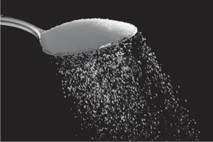  ??  ?? ABOVE: Granulated sugar is shown Sept. 12, 2016, in Philadelph­ia. U.S. President Donald Trump recently praised a new sugar deal with Mexico. But U.S. food makers say it will result in Americans paying even more for sugar than they already are.