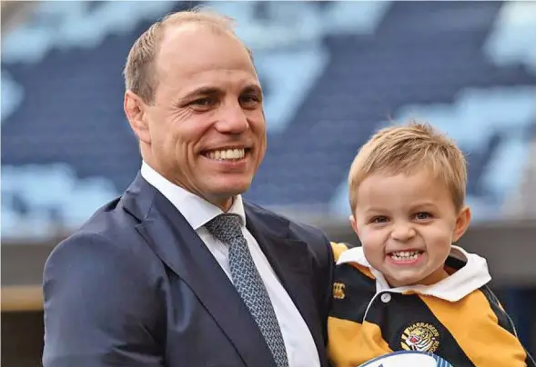  ?? Photo: AAP ?? Rugby Australia chief executive officer Phil Waugh with his son Arthur.